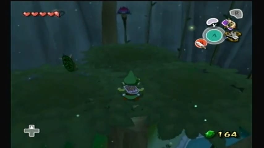 Schermata di Link che scala il Grande Albero Deku per ottenere la Foglia Deku
