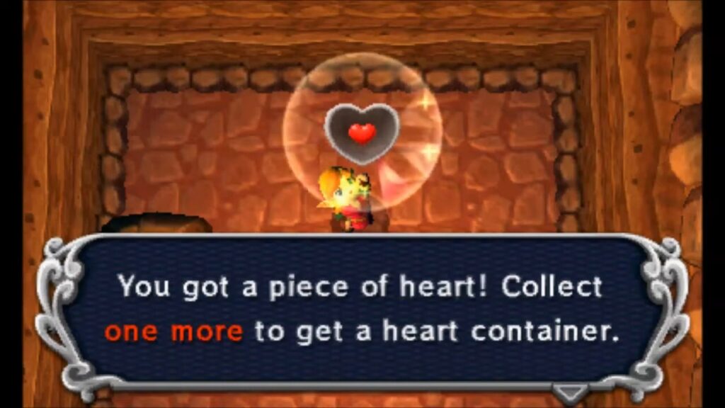 Heart Piece Locations 88 Link claiming the Piece of Heart in the high cave north of the Graveyard in A Link Between Worlds