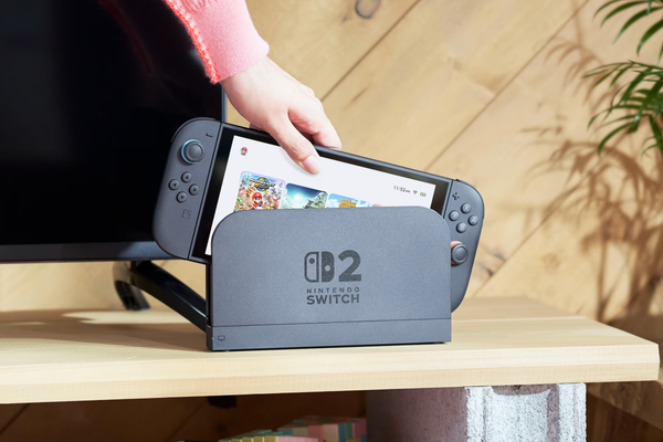 Nintendo Switch 2 console being placed into its dock for TV mode