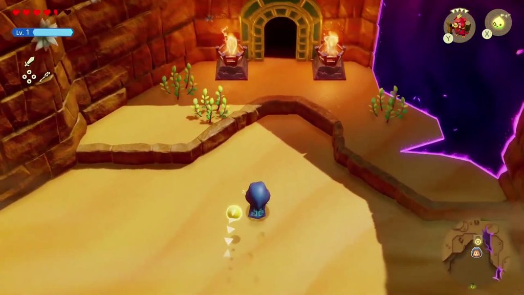 A Rift in the Gerudo Desert - The Legend of Zelda: Echoes of Wisdom Walkthrough 42 Zelda approaches the brazier-lit doorway of the Ancestor's Cave of Rest beside a rift.