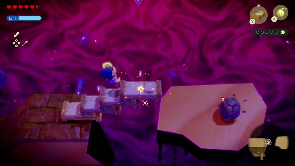 A Rift in the Gerudo Desert - The Legend of Zelda: Echoes of Wisdom Walkthrough 69 A bridge of Old Beds leads to a floating island holding a dark boulder that traps a Tri friend.