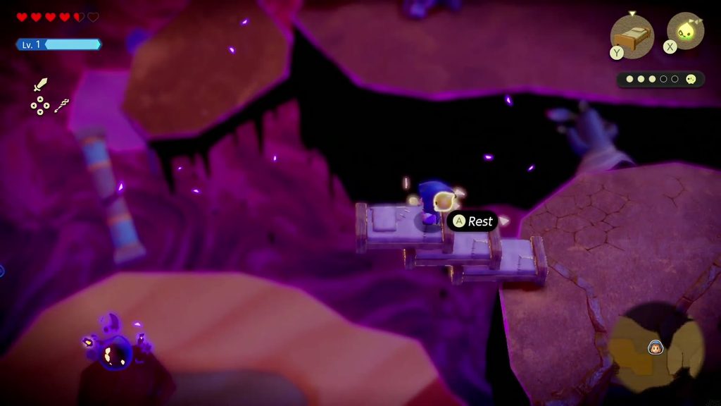A Rift in the Gerudo Desert - The Legend of Zelda: Echoes of Wisdom Walkthrough 79 Zelda stands on stacked Old Bed echoes beside a red pillar in the Still World