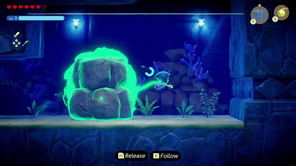 Zelda swims right and uses Bind on the first boulder blocking the underwater passage to drag it aside.