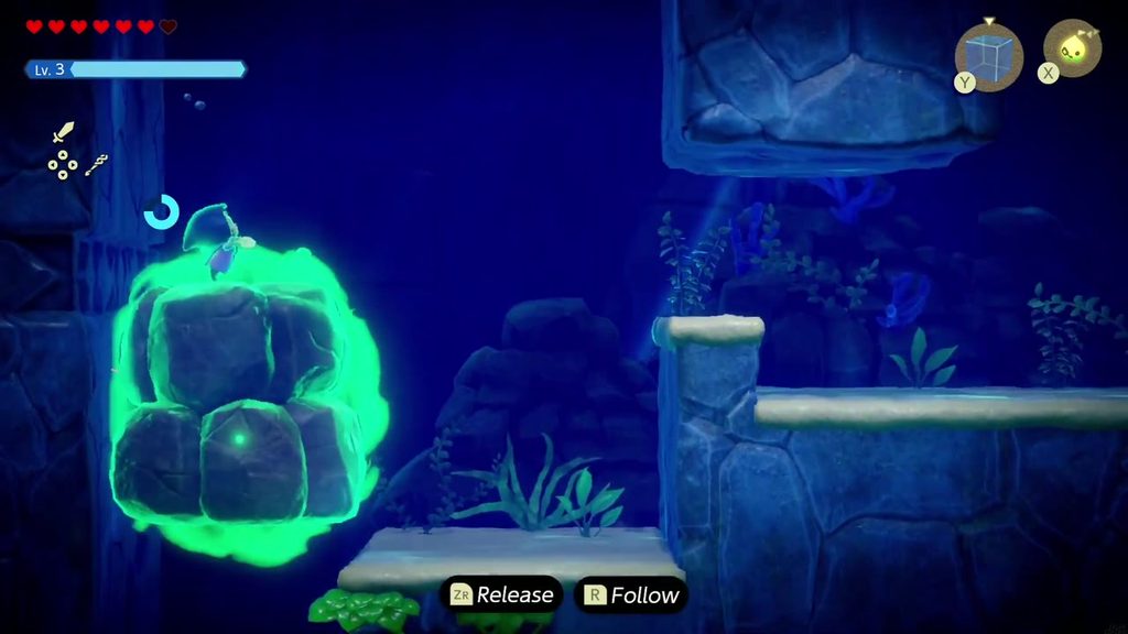 Zelda Binds the second boulder at the bottom of the pit and hauls it upward out of the way.
