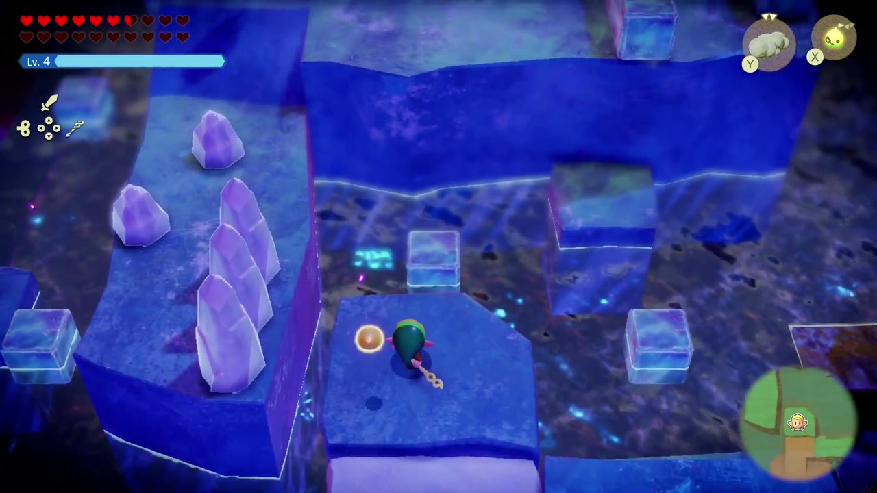 The Eternal Forest - The Legend of Zelda: Echoes of Wisdom Walkthrough 70 Zelda enters the blue ice room with ice crystals and ice blocks in the Stilled Ancient Ruins.