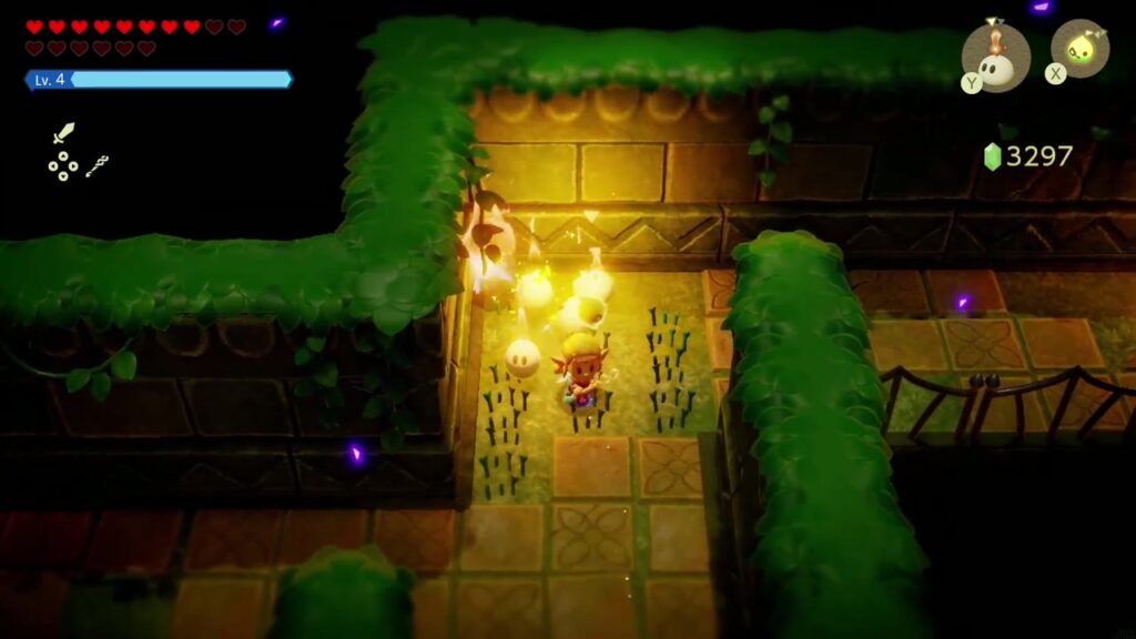 Faron Temple Dungeon - The Legend of Zelda: Echoes of Wisdom Walkthrough 7 A fire echo burns through grass in a torch-lit hedge corridor as Zelda works north through the dark rooms.
