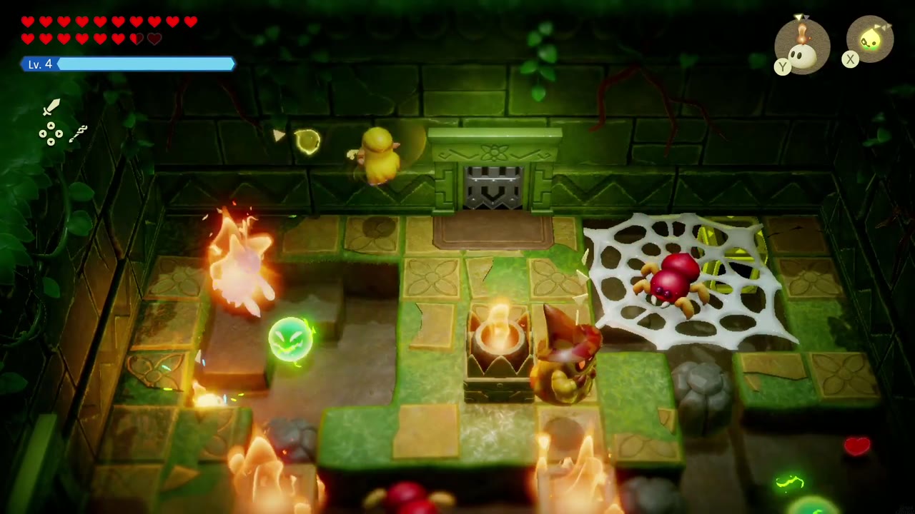 Fire burns across the web-covered room as Zelda fights a red spider in the Hidden Ruins. Fire burns across the web-covered room as Zelda fights a red spider in the Hidden Ruins.
