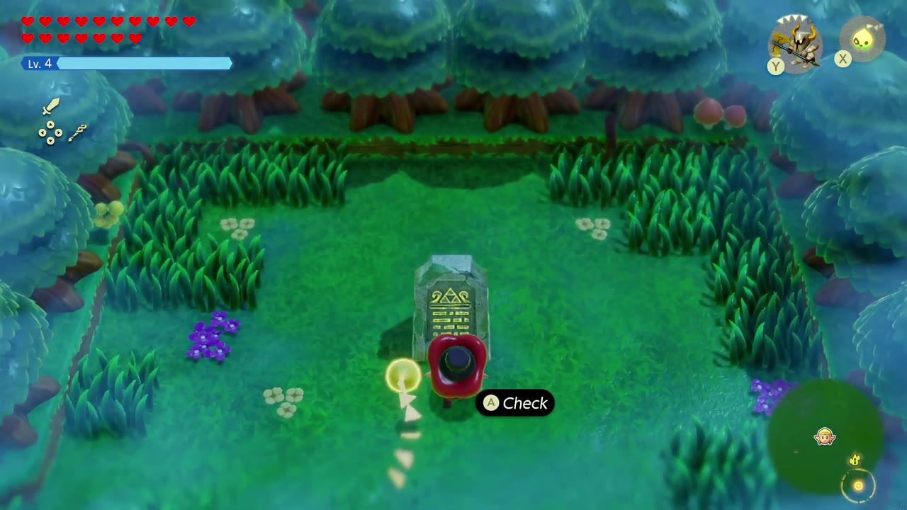 The Eternal Forest - The Legend of Zelda: Echoes of Wisdom Walkthrough 20 Zelda walks up to the small stone tablet in the clearing with the Check prompt showing.