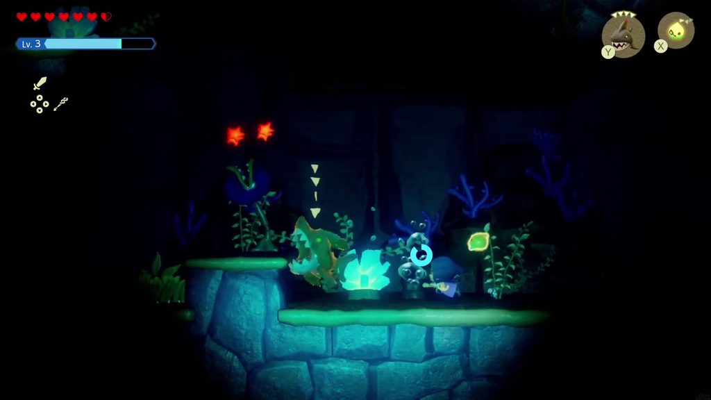 A summoned Chompfin echo lunges at a red-eyed Bio Deku Baba beside the glowing coral in the dark water.