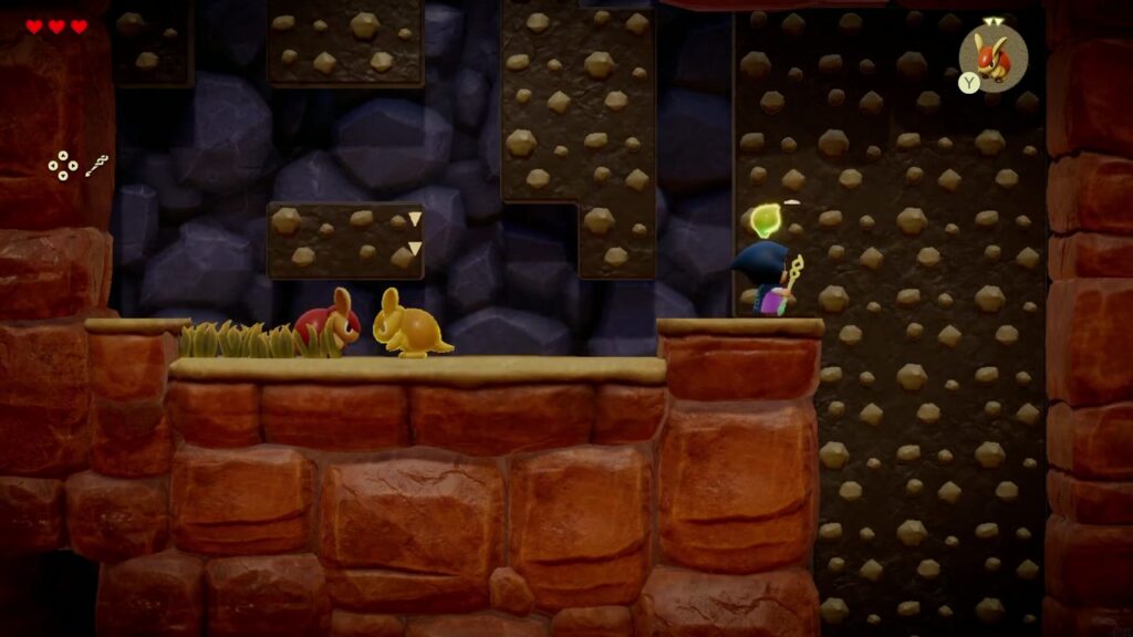 Zelda klettert die mit Stacheln besetzte Wand an den Caromadillos vorbei hinauf, um in einer Schleife zurück zum Herzvorsprung zu gelangen.