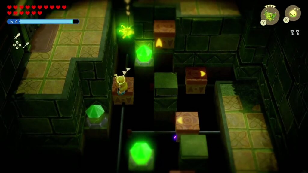 Faron Temple Dungeon - The Legend of Zelda: Echoes of Wisdom Walkthrough 27 Several crystal switches glow bright green as Zelda keeps lighting them in the dark pit room.