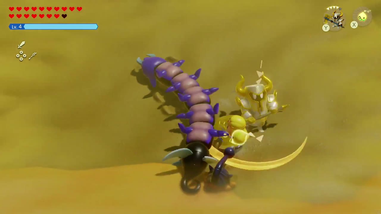 A Rift in the Gerudo Desert - The Legend of Zelda: Echoes of Wisdom Walkthrough 127 A Darknut echo slashes the purple Lanmola centipede as it bursts from the sand in the Gerudo Desert sandstorm.