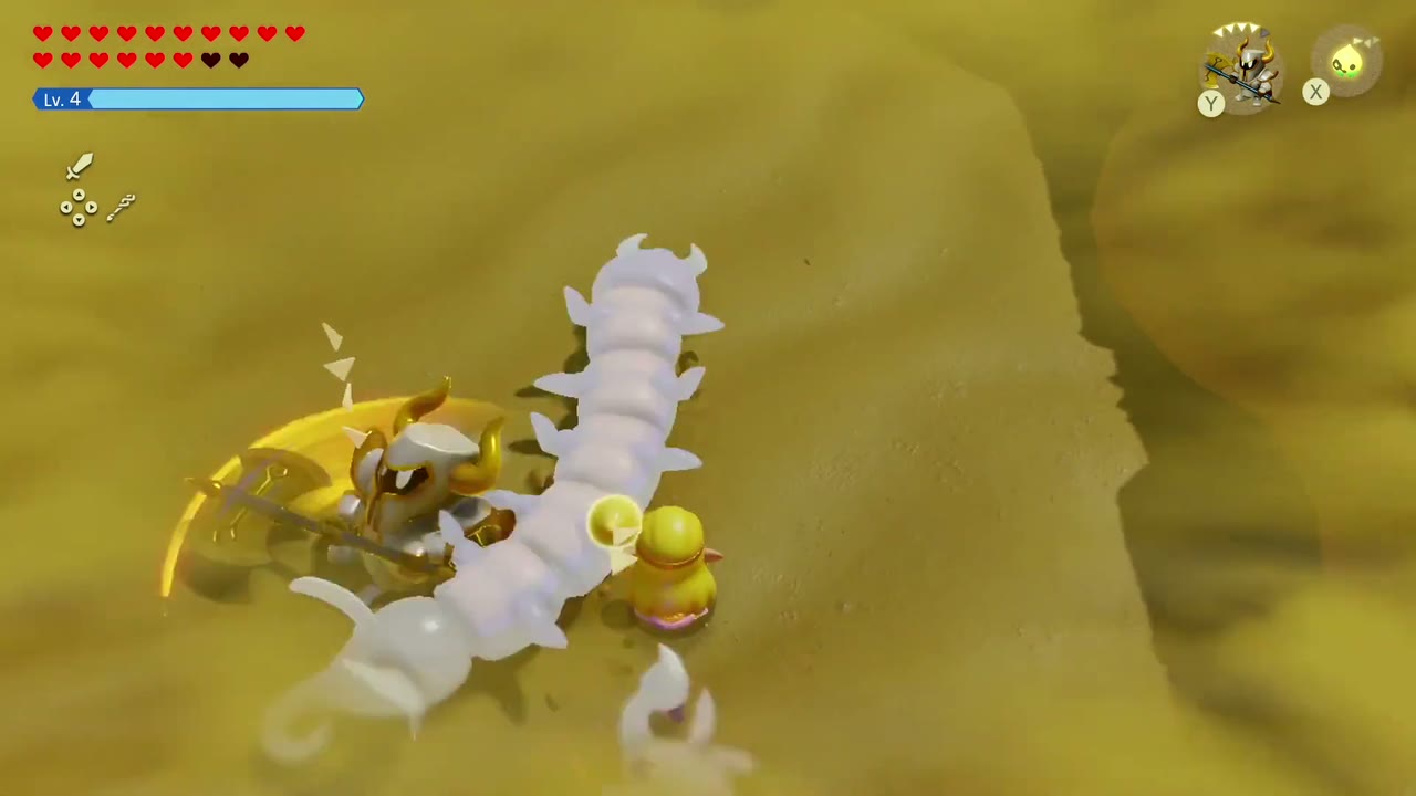 A Darknut echo swings its glaive at the Lanmola's spiked body segments. A Darknut echo swings its glaive at the Lanmola's spiked body segments.
