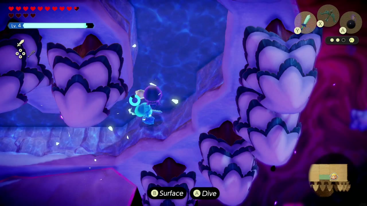 Zelda taucht durch einen Wasserkanal zwischen schneebedeckten Felsen, wobei die Aufforderungen "Auftauchen" und "Tauchen" angezeigt werden. Zelda taucht durch einen Wasserkanal zwischen schneebedeckten Felsen, wobei die Aufforderungen "Auftauchen" und "Tauchen" angezeigt werden.