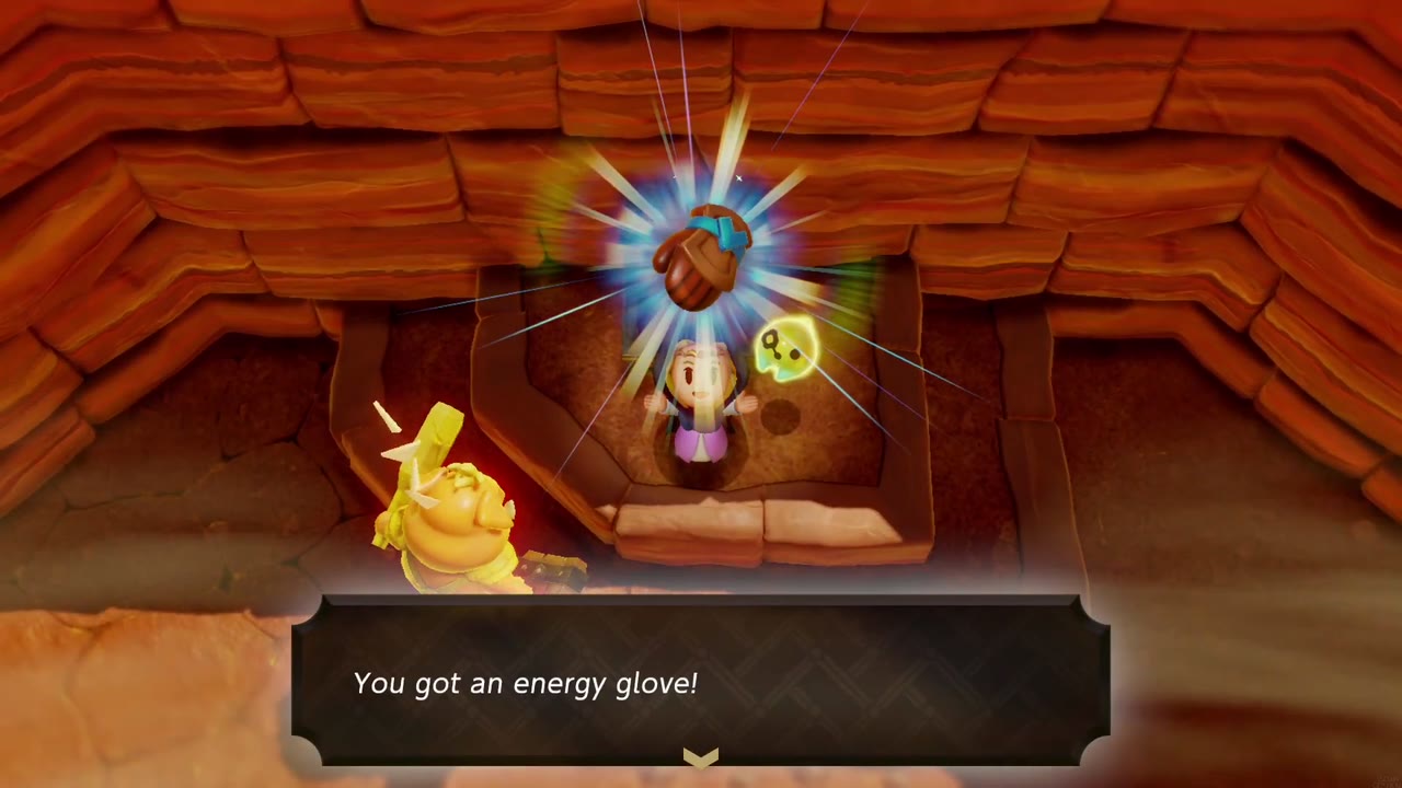 Zelda holds up the Energy Glove from the chest in a sunken red-rock nook in Gerudo Desert Zelda holds up the Energy Glove from the chest in a sunken red-rock nook in Gerudo Desert