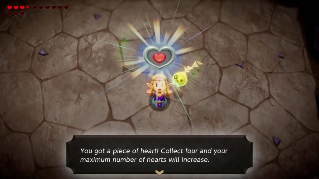 Zelda hält das vom Flammenriesen zurückgelassene Herzteil hoch, zusammen mit der Aufschrift „Du hast ein Herzteil bekommen!“.