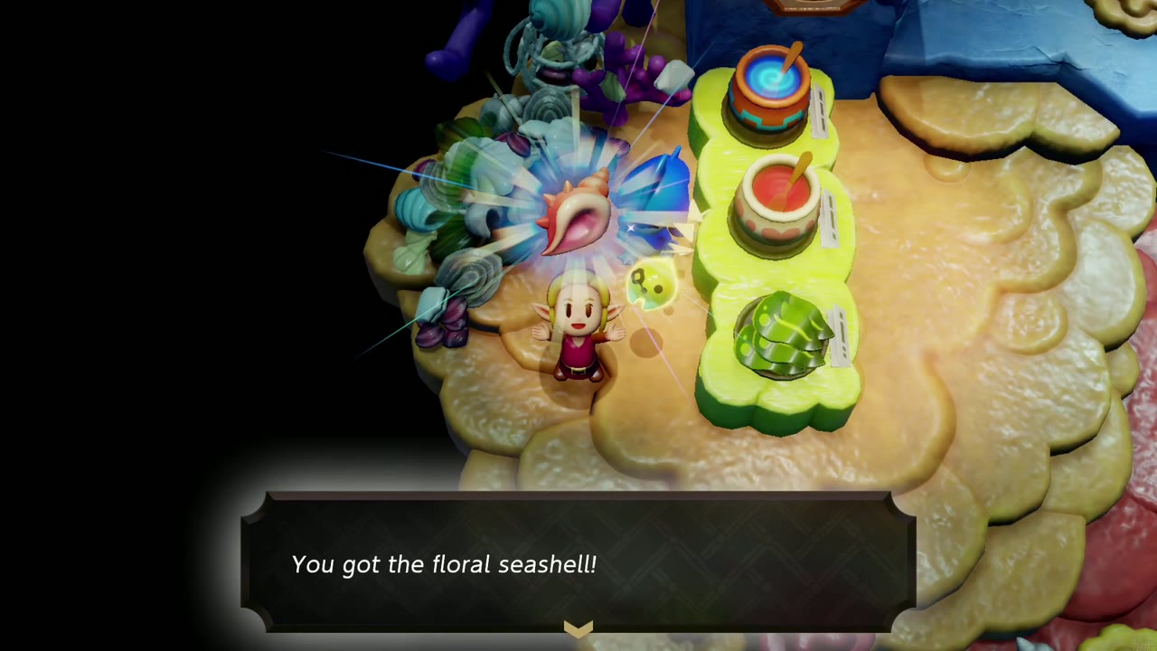 Zelda receives the floral seashell from a Sea Zora collector in Sea Zora Village. Zelda receives the floral seashell from a Sea Zora collector in Sea Zora Village.