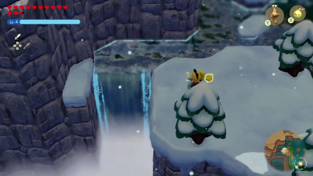 Hebra Mountain: A Rift on Holy Mount Lanayru - The Legend of Zelda: Echoes of Wisdom Walkthrough 54 Zelda reaches the snowy ledge beside the waterfall on the north side of the frozen lake.