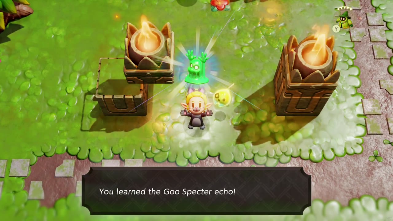 Zelda aprende o eco do Espectro Goo entre duas tochas acesas nos pântanos orientais de Faron. Zelda aprende o eco do Espectro Goo entre duas tochas acesas nos pântanos orientais de Faron.