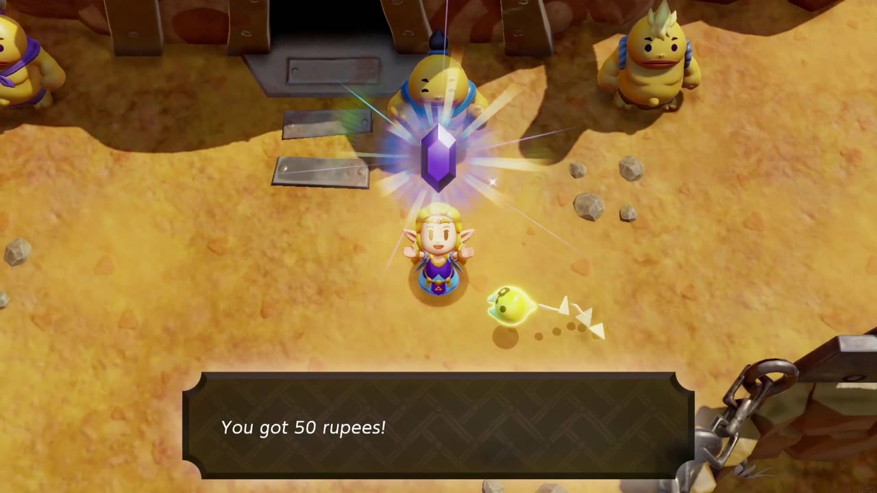 Zelda holds up the 50 Rupees won from the Goron Race on Eldin Volcano. Zelda holds up the 50 Rupees won from the Goron Race on Eldin Volcano.