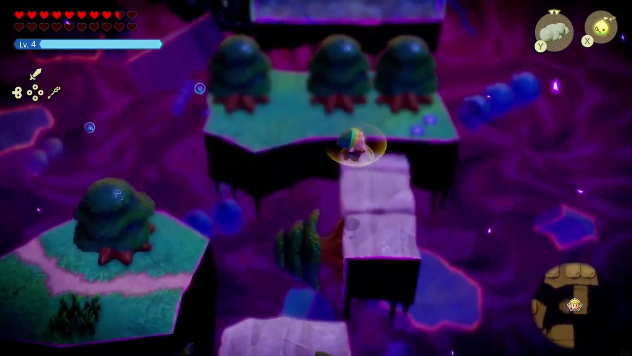 The Eternal Forest - The Legend of Zelda: Echoes of Wisdom Walkthrough 65 Zelda arrives on a raised grass island with pale stone blocks, past the water columns in the Stilled Ancient Ruins.