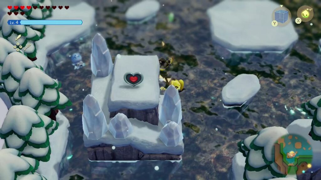 Hebra Mountain: A Rift on Holy Mount Lanayru - The Legend of Zelda: Echoes of Wisdom Walkthrough 102 The Piece of Heart on an ice pedestal ringed by ice spikes, with a Water Block echo placed beside it.
