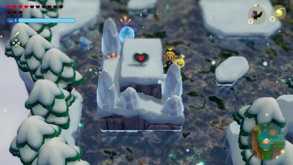 Ein Herzteil auf einem von Eisspitzen umgebenen Eissockel im zugefrorenen See des Hebra-Gebirges, Zelda auf der Eisscholle daneben.