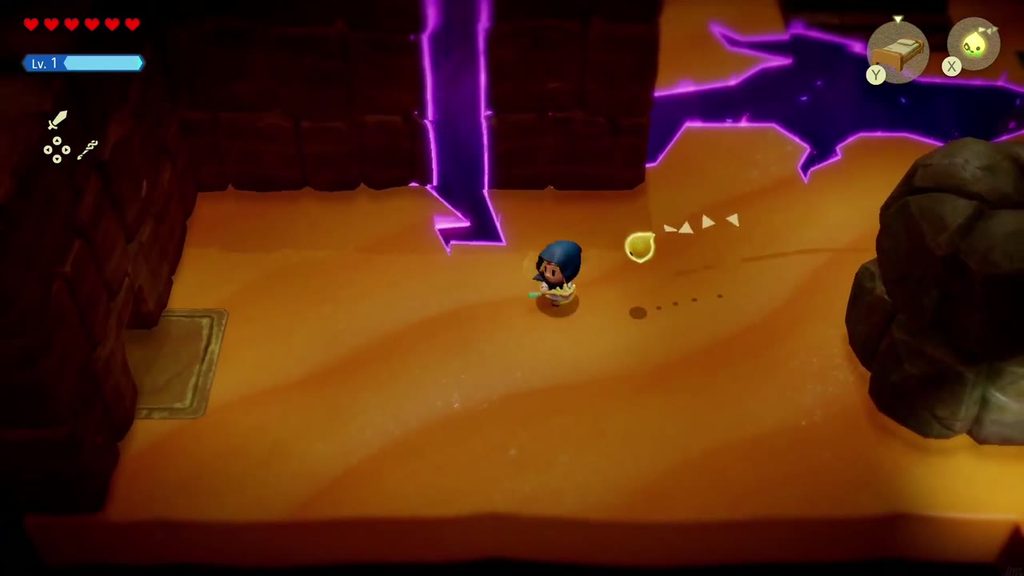 A Rift in the Gerudo Desert - The Legend of Zelda: Echoes of Wisdom Walkthrough 46 With the boulder dragged aside, a doorway in the left wall of the cave's entrance chamber is exposed.