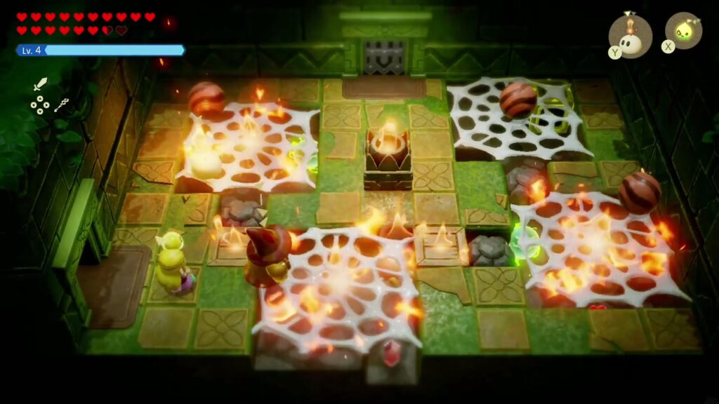 A Rift in the Faron Wetlands - The Legend of Zelda: Echoes of Wisdom Walkthrough 68 Flames burning the spiderwebs in the Hidden Ruins' first chamber while Crawltulas skitter around the floor.