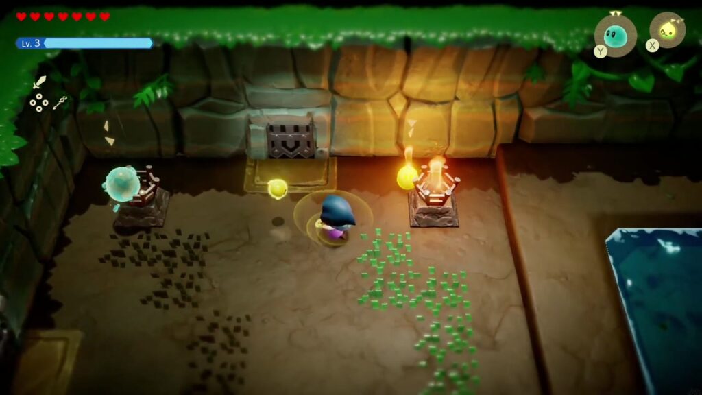 Ein Hydrozol-Echo spritzt in eine Feuerschale neben der vergitterten Tür, während Zelda danebensteht.