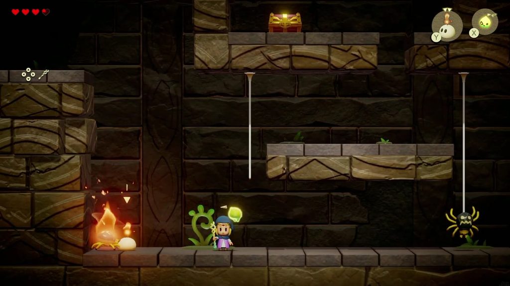An Ignizol echo sets a Strandtula spider alight on the lower floor of the side-scrolling cave