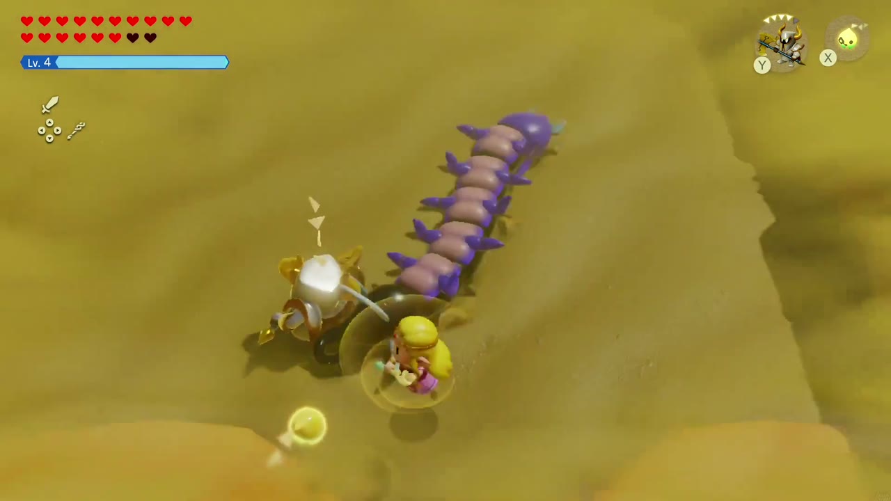 A Darknut echo strikes the purple Lanmola as it rears out of the sand in the sandstorm. A Darknut echo strikes the purple Lanmola as it rears out of the sand in the sandstorm.