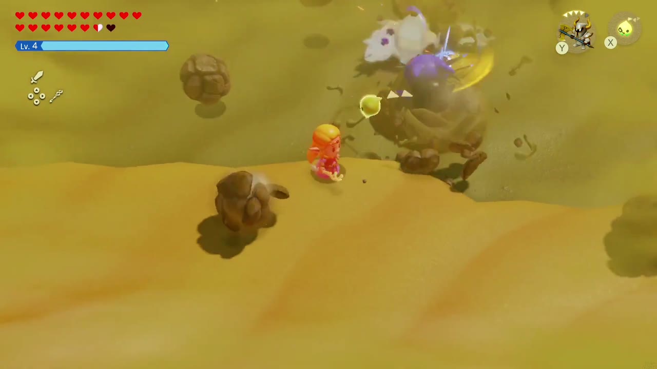 The Lanmola's head bursts from the sand right next to Zelda. The Lanmola's head bursts from the sand right next to Zelda.
