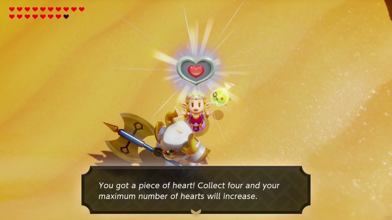Zelda holds up the Piece of Heart dropped by the defeated Lanmola in the desert. Zelda holds up the Piece of Heart dropped by the defeated Lanmola in the desert.