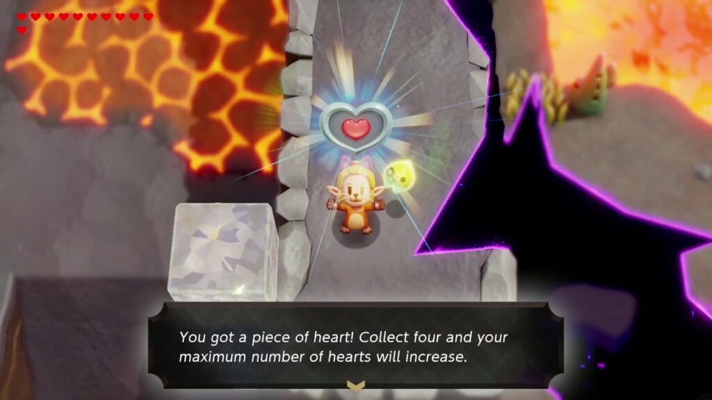 Zelda hält das Herzteil auf dem Steinblock neben dem Riss hoch, daneben die Box mit der Aufschrift „Du hast ein Herzteil erhalten!“.