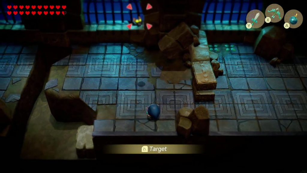 Link crosses a blue-lit ruins chamber toward an enemy as the Target tutorial prompt appears