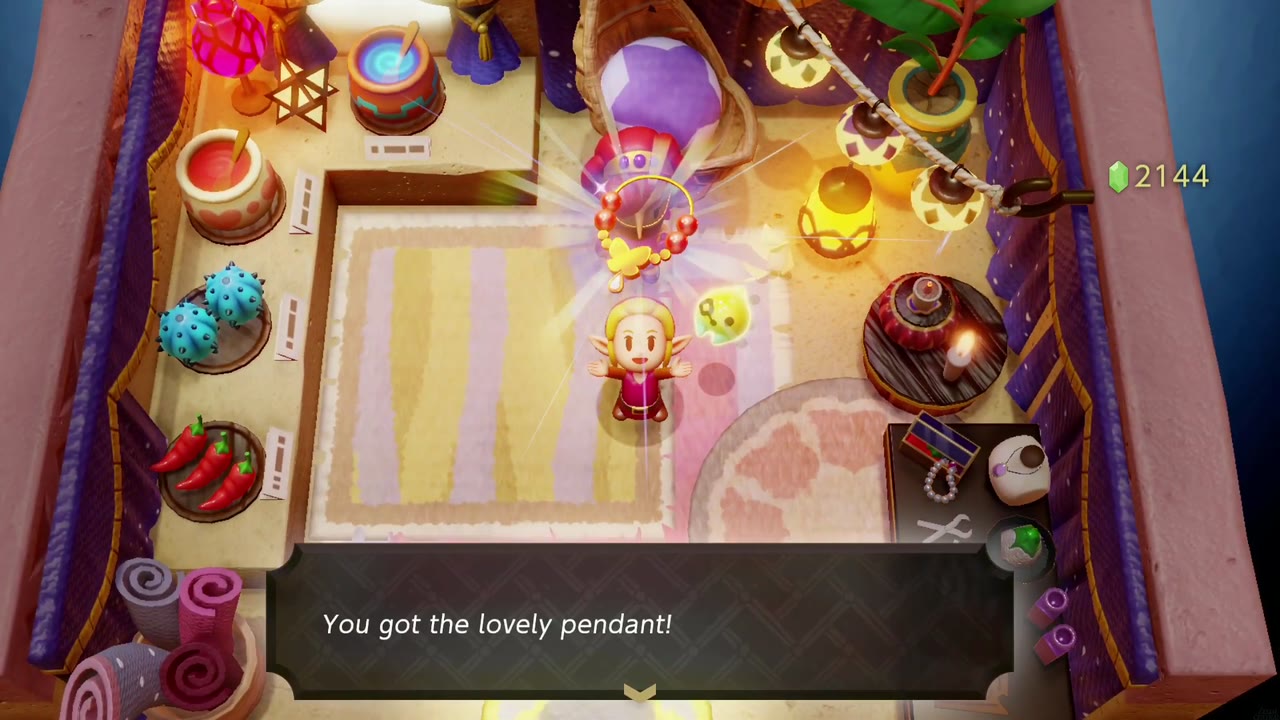 Zelda holds up the Lovely Pendant in the Gerudo Shop as the get message appears Zelda holds up the Lovely Pendant in the Gerudo Shop as the get message appears