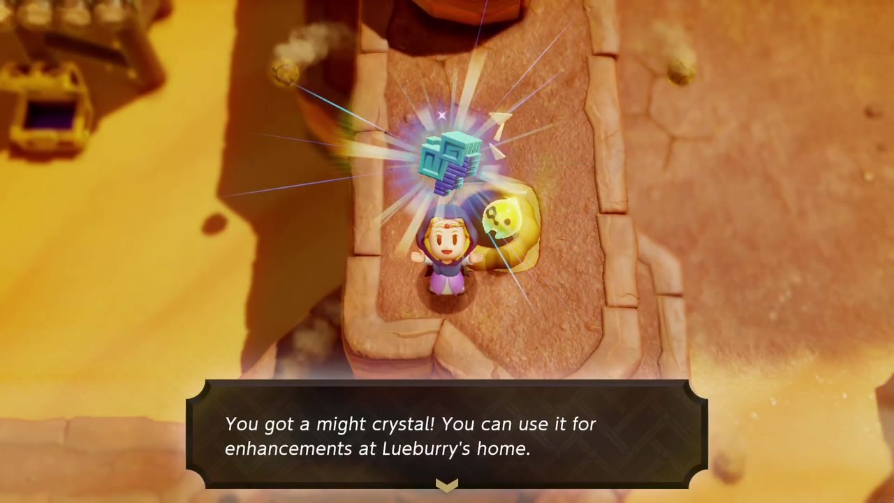 Zelda holds up a might crystal on a narrow red-rock ridge in a Gerudo Desert canyon, a Holmill echo beside her