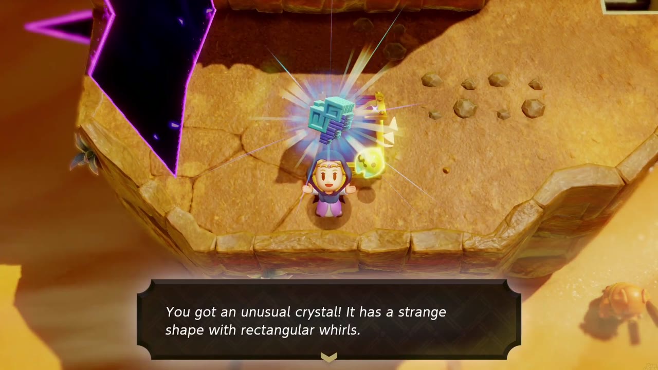 Zelda holds up an unusual crystal beside an open chest on a rock ledge next to a purple rift in Gerudo Desert