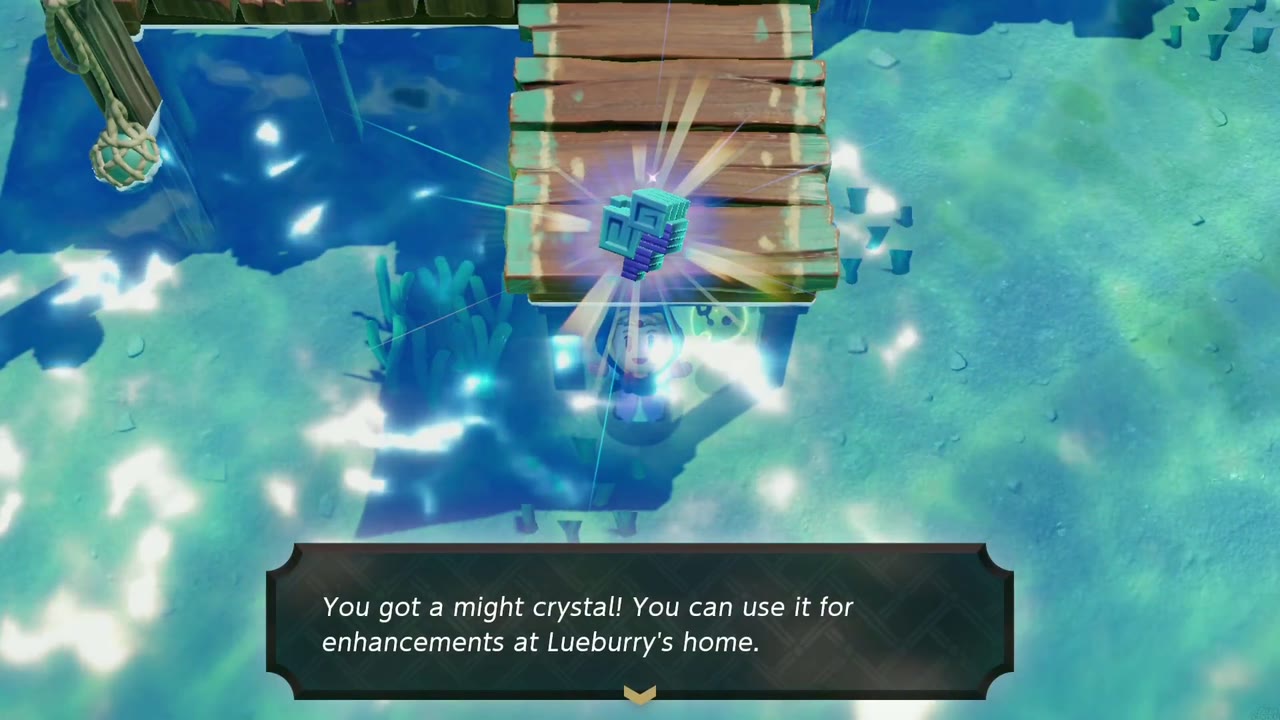 Underwater beneath a wooden pier, Zelda holds a might crystal overhead with the 'You got a might crystal!' box below