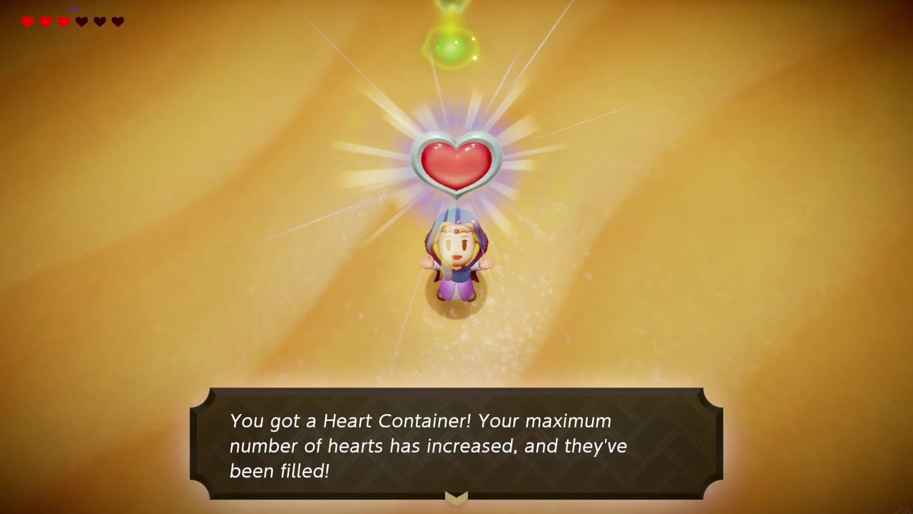 Gerudo Sanctum Dungeon - The Legend of Zelda: Echoes of Wisdom Walkthrough 141 Zelda holds up the Heart Container won from Mogryph, with the "You got a Heart Container!" text box.