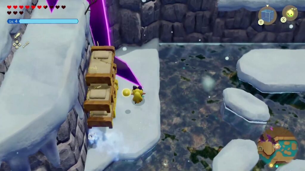 Hebra Mountain: A Rift on Holy Mount Lanayru - The Legend of Zelda: Echoes of Wisdom Walkthrough 104 Zelda climbs a stack of Old Bed echoes up a cliff beside a rift on Hebra Mountain.