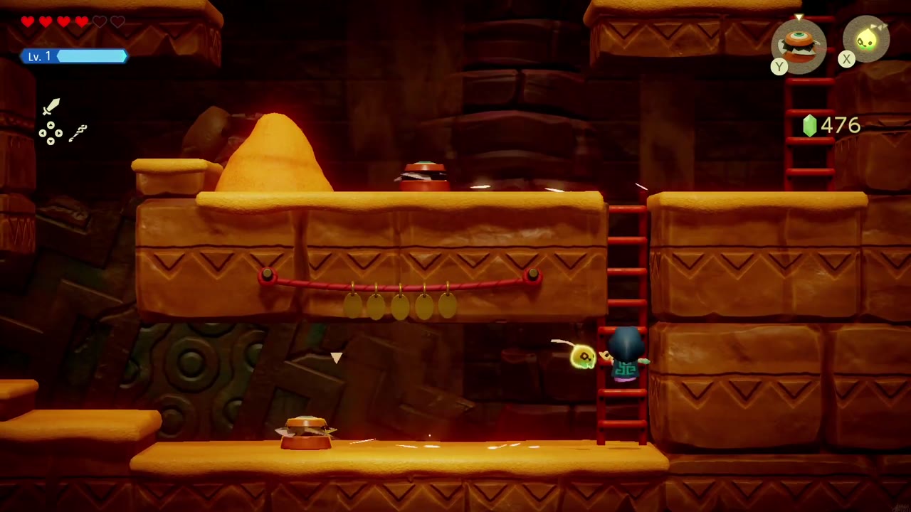 Um Pathblade em uma saliência no jogo de rolagem lateral. Gerudo Caverna no deserto, com Zelda em uma escada abaixo. Um Pathblade em uma saliência no jogo de rolagem lateral. Gerudo Caverna no deserto, com Zelda em uma escada abaixo.