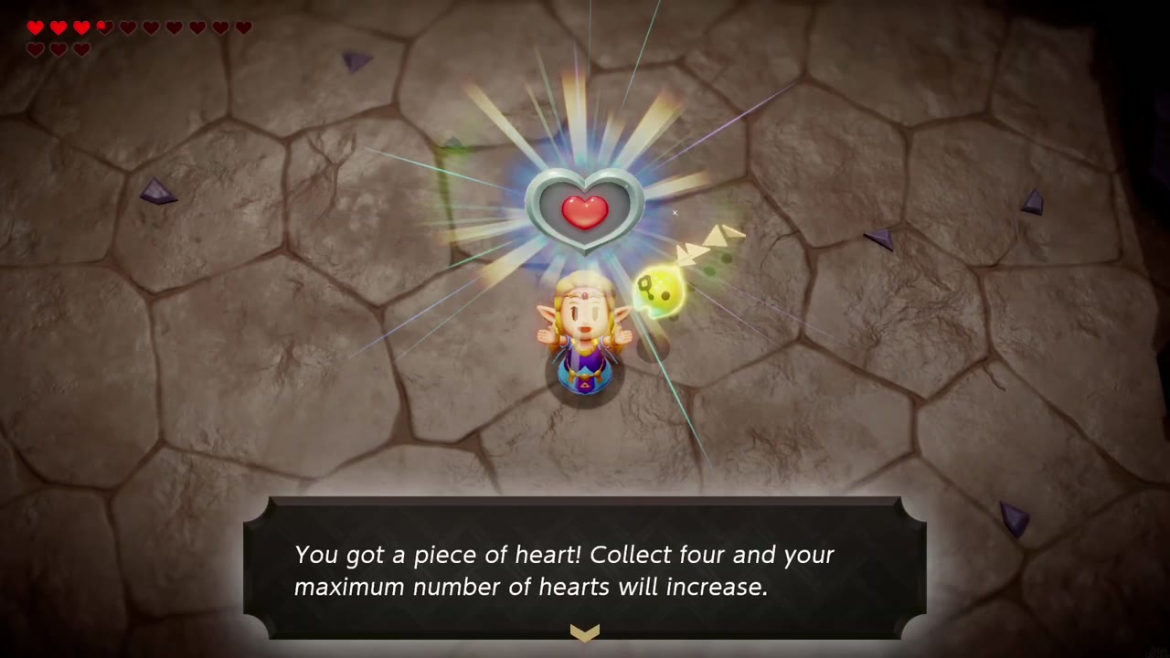 Zelda holds up the Piece of Heart dropped by the flame giant in A Mountainous Mystery Zelda holds up the Piece of Heart dropped by the flame giant in A Mountainous Mystery