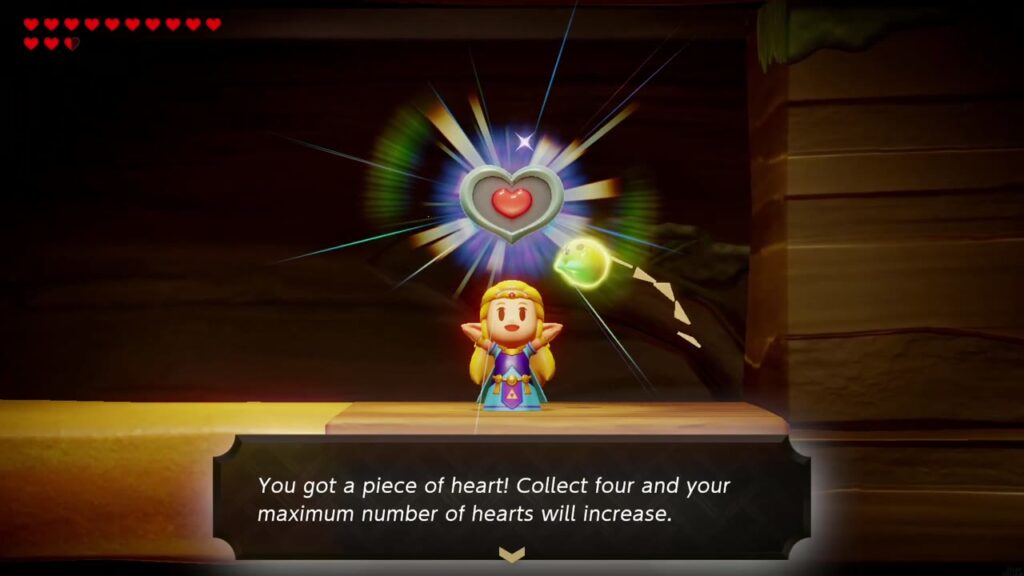 Zelda hält das Herzteil in dem kleinen unterirdischen Raum, der seitlich zu sehen ist, hoch.