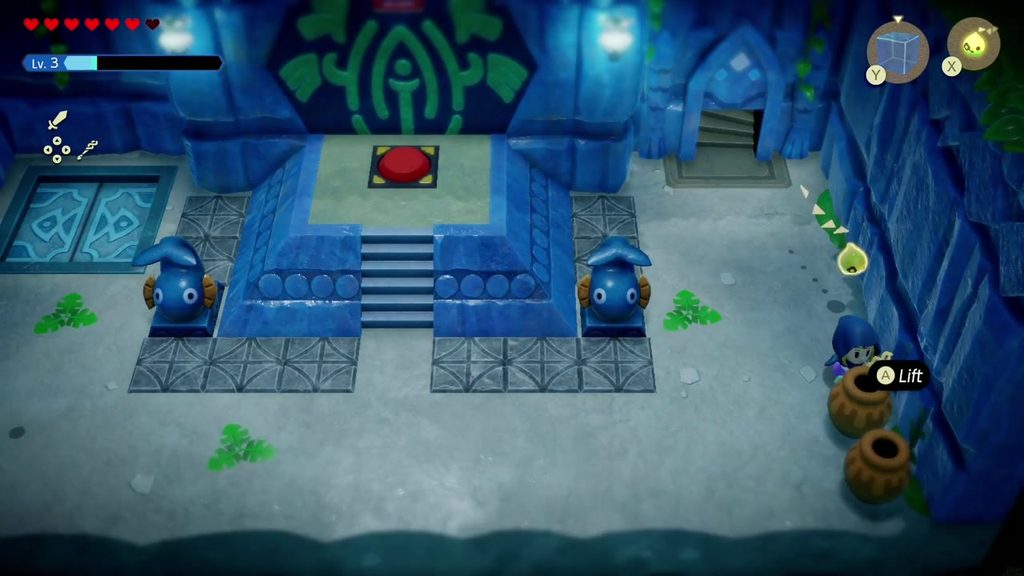 The red switch sits on a dais between two fish statues in Jabul Ruins.