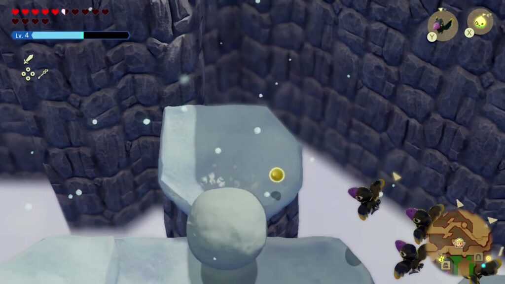 Hebra Mountain: A Rift on Holy Mount Lanayru - The Legend of Zelda: Echoes of Wisdom Walkthrough 107 A giant snowball rolls down the snowy terraces below the summit where the Piece of Heart waits