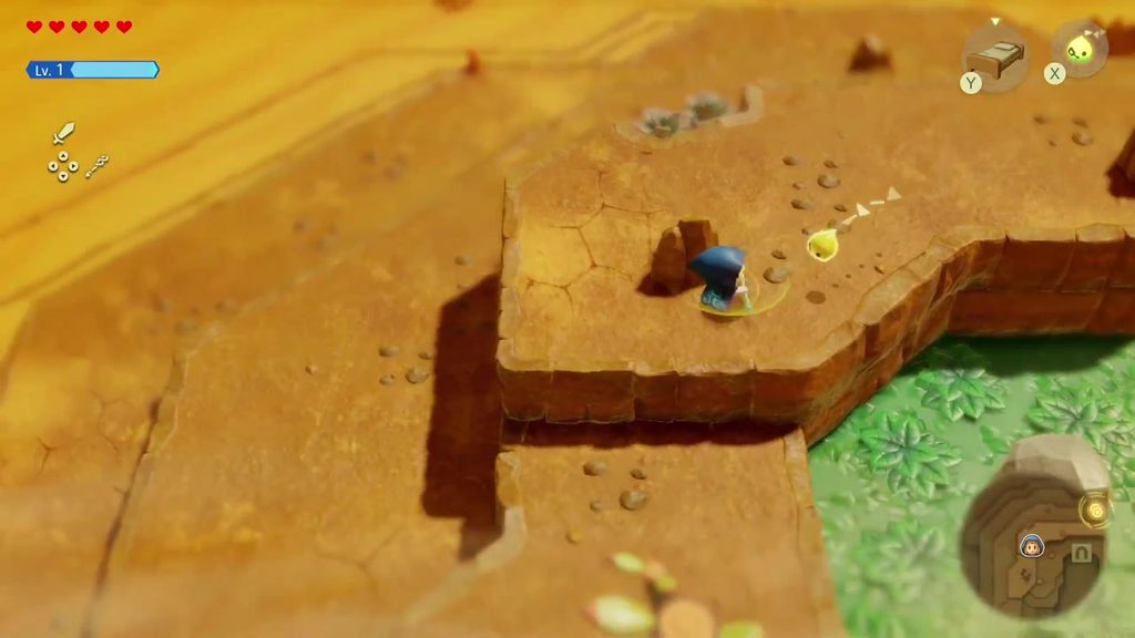 A Rift in the Gerudo Desert - The Legend of Zelda: Echoes of Wisdom Walkthrough 3 Zelda steps from Hyrule Field's grass onto the sandy ledges that lead down into the Gerudo Desert.