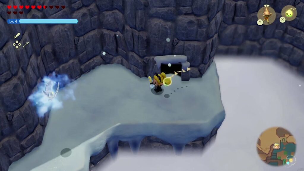 Hebra Mountain: A Rift on Holy Mount Lanayru - The Legend of Zelda: Echoes of Wisdom Walkthrough 69 Zelda steps out of the cave onto the snowy cliff ledge above the frozen lake.