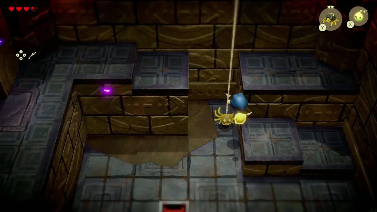 Zelda summons a Strandtula beside the high back ledge and grabs its silk